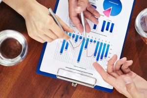 Illustration of market research data and graph shows on clipboard for discussion